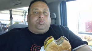 Jon Galloway Look Alike eats a Cheeseburger